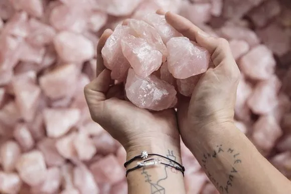 Rose quartz maintenance and care demonstration showing proper storage and cleaning techniques