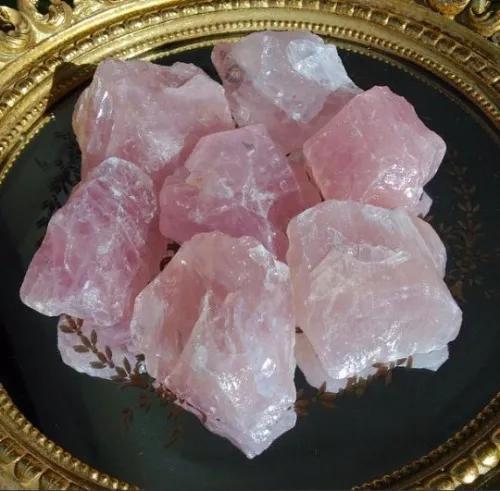 Hand holding rose quartz