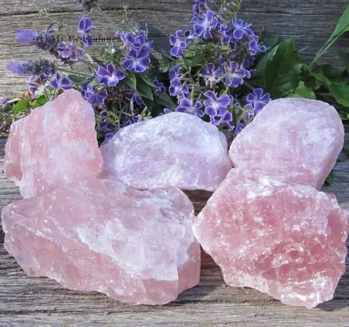 Inspecting rose quartz surface quality under magnification loupe