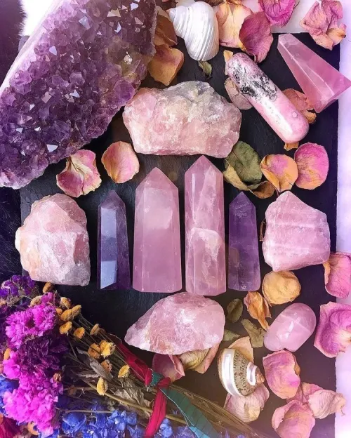 Libra scales with rose quartz jewelry arrangements