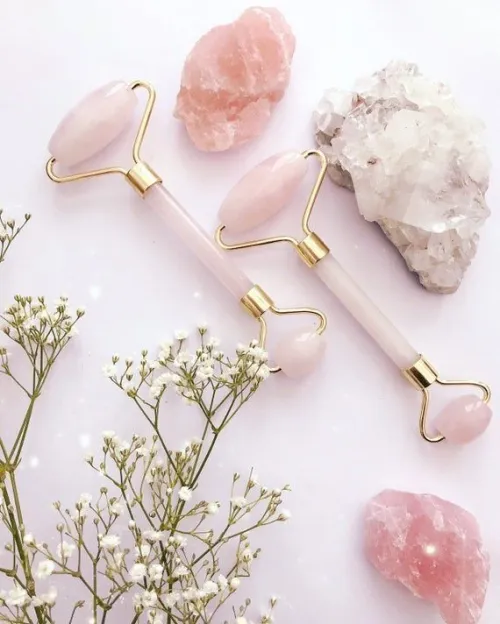 Rose quartz bracelet in bathroom setting with water droplets, illustrating shower exposure concerns