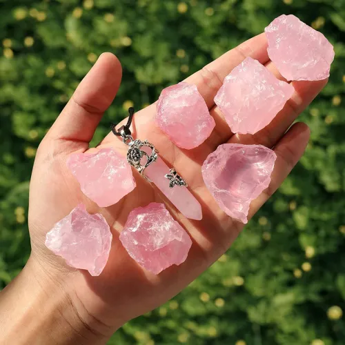 Rose quartz crystals arranged in circular meditation pattern